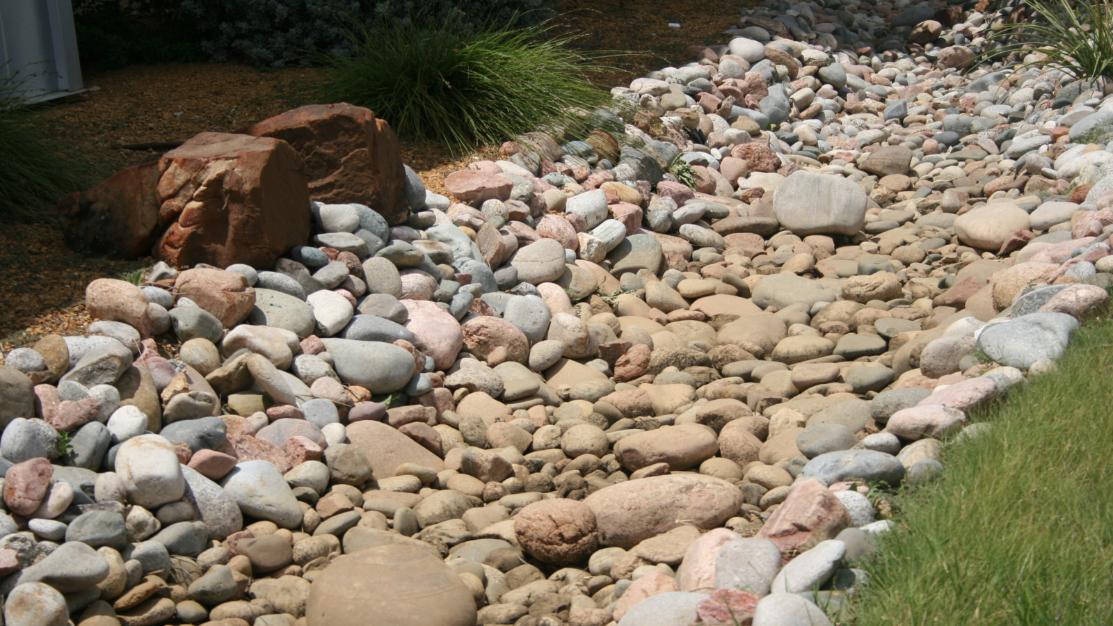 River Rock Is a Great Choice for the Ground Cover in Your Landscape Beds